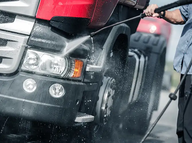 commercial power washing services, spraying a semi truck - edwardsville illinois